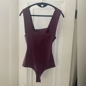 NWT never worn Free People intimately open back bodysuit; deep purple